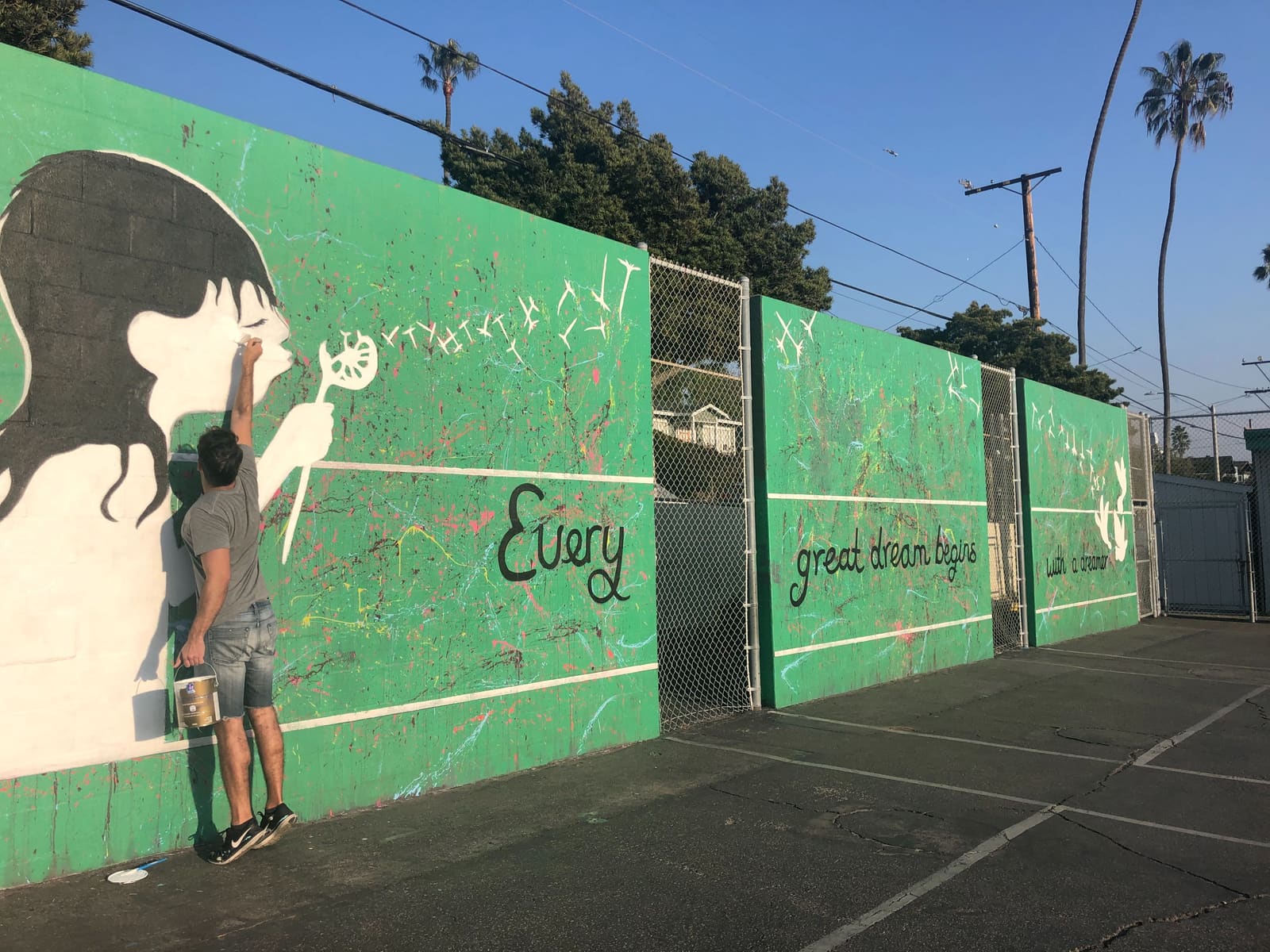 Green schoolyard mural by Ruben Rojas